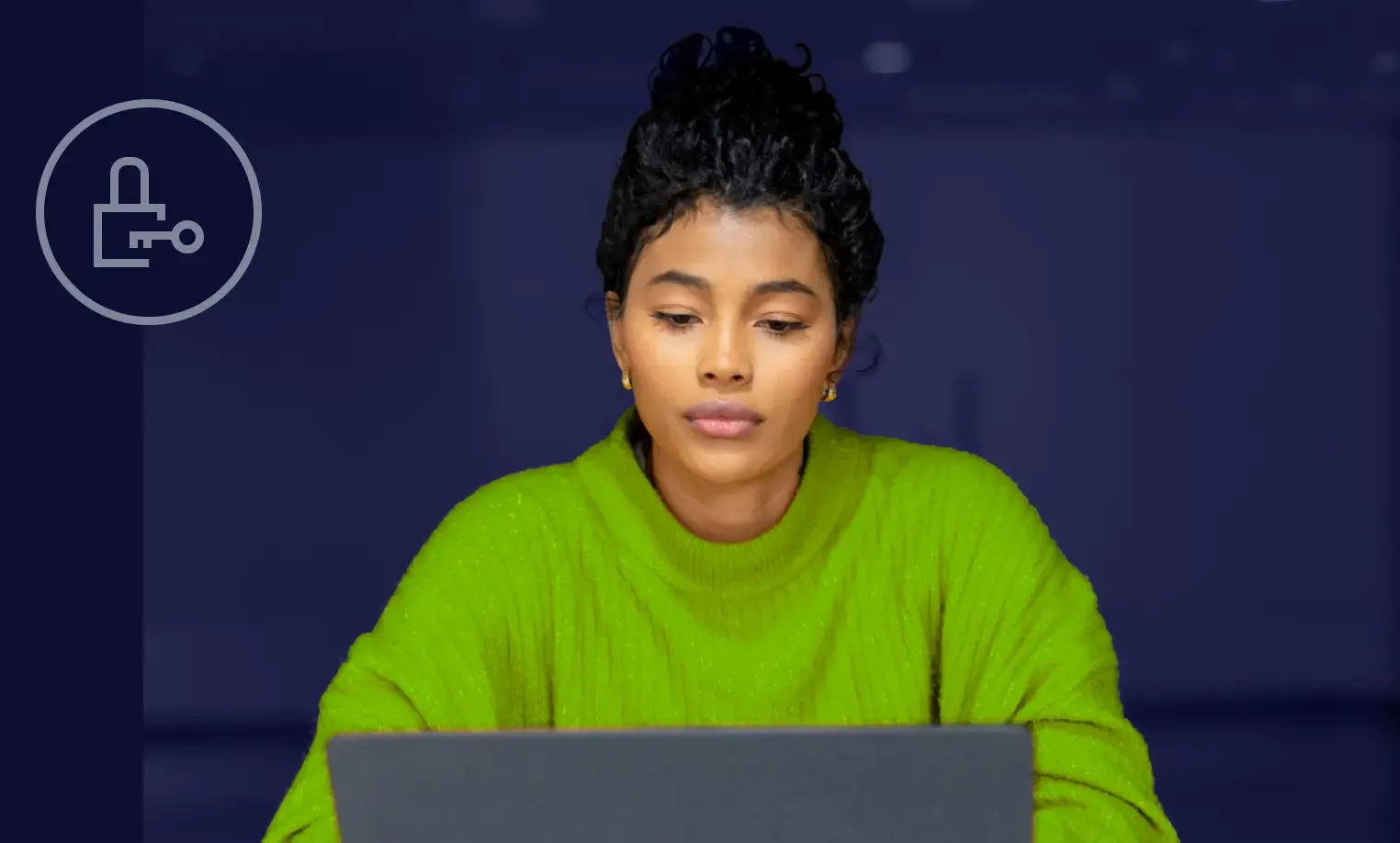 IT professional reviewing access control data on laptop