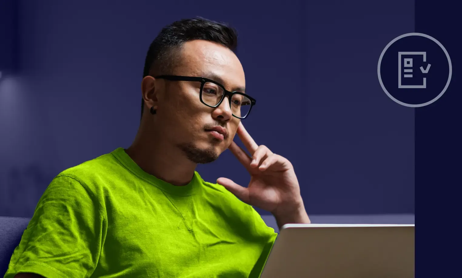 IT professional reviewing compliance audit data on laptop