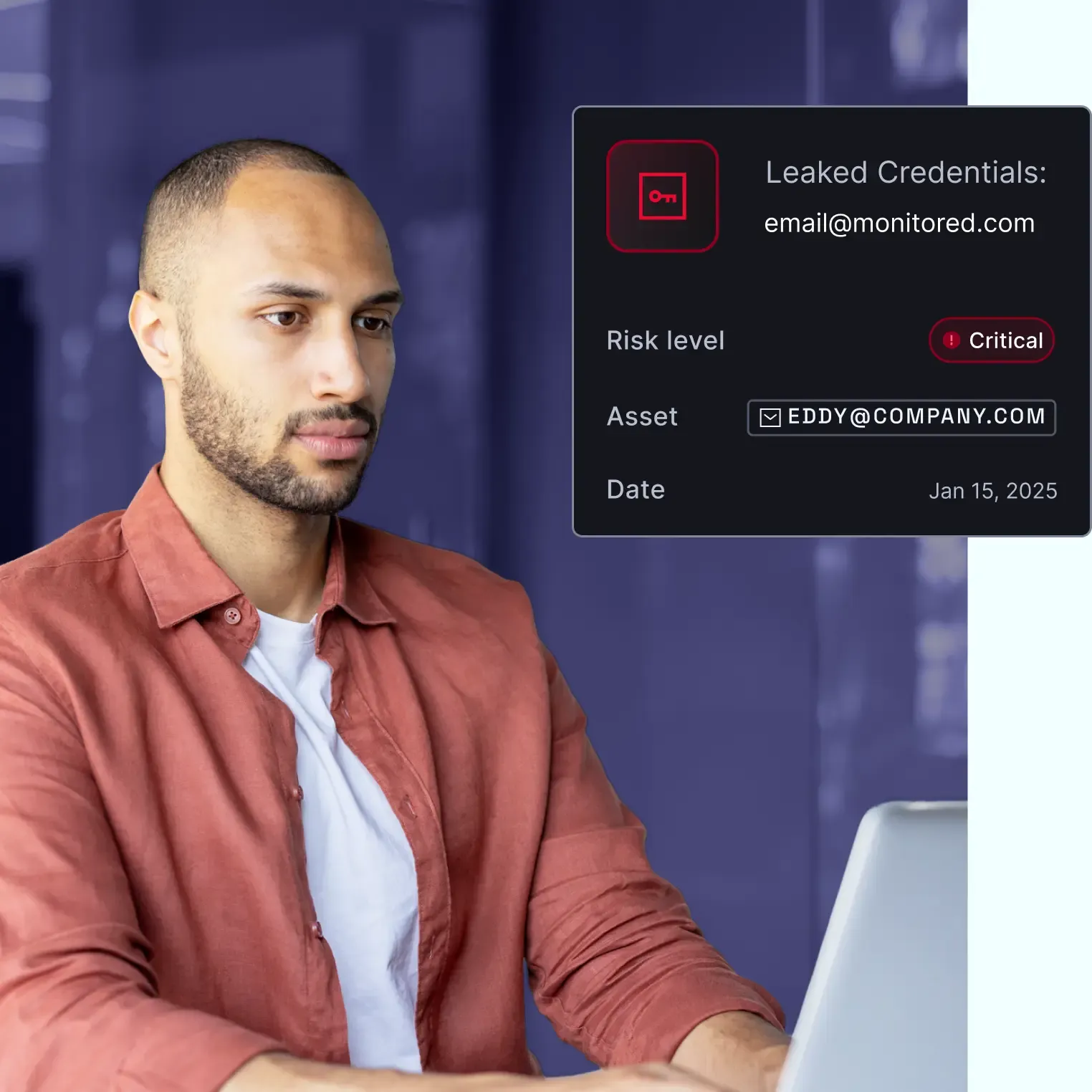 Professional reviewing critical credential leak alert for monitored email account