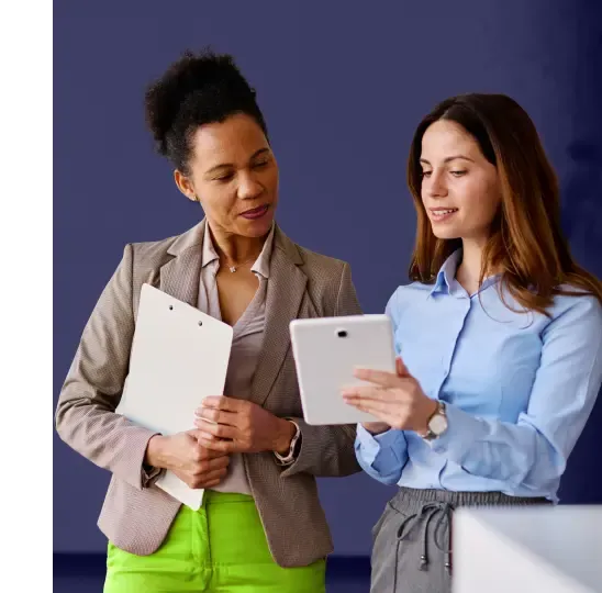 Two people with tablet managing trusted locations for network access control policy